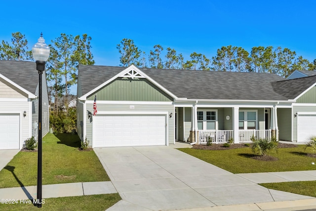 ranch-style home with a porch, a garage, and a front lawn