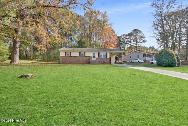 single story home with a front lawn and a carport