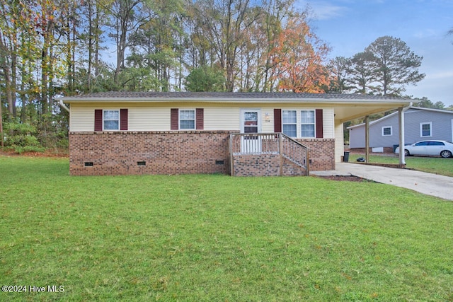 ranch-style home with a carport and a front lawn