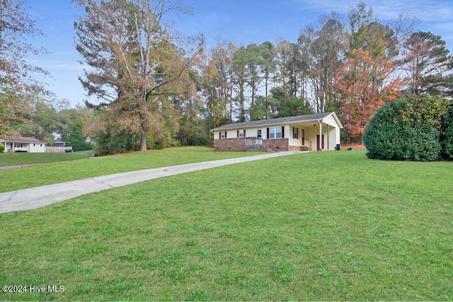 ranch-style home with a front lawn