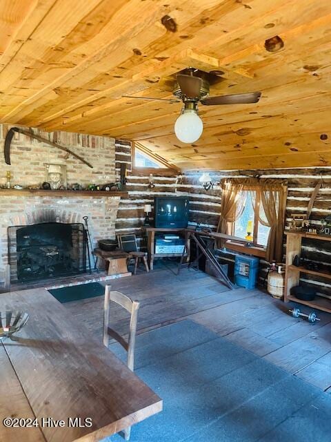 misc room with a brick fireplace, wood ceiling, and vaulted ceiling