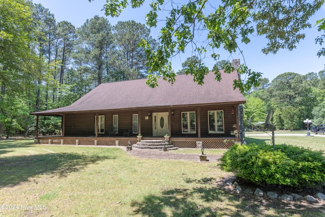 view of front facade featuring covered porch and a front lawn