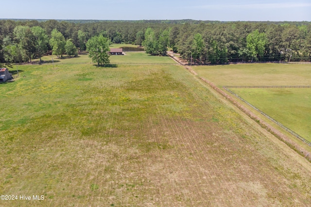 birds eye view of property with a rural view