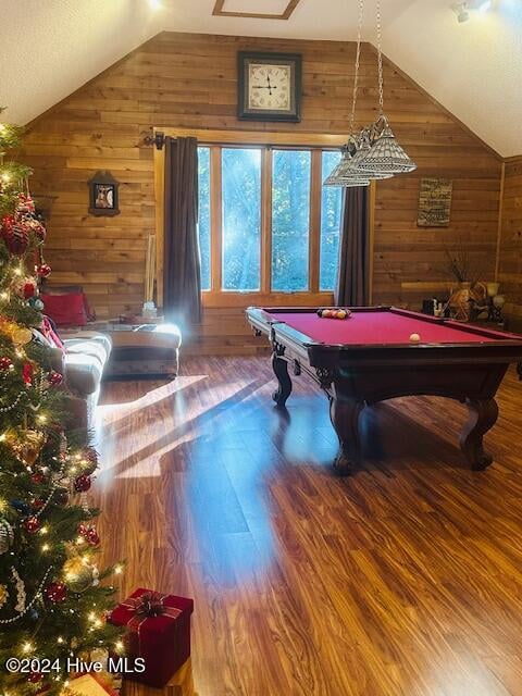 playroom with pool table, lofted ceiling, wooden walls, and wood-type flooring