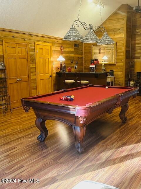 rec room featuring wood walls, vaulted ceiling, billiards, and hardwood / wood-style floors