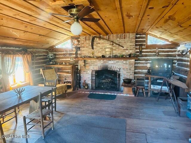 unfurnished living room featuring a brick fireplace, vaulted ceiling with beams, ceiling fan, and wood ceiling