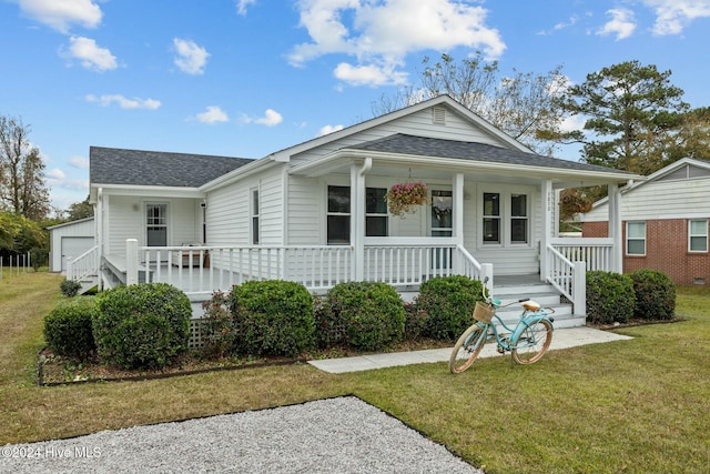 bungalow-style house with a porch and a front lawn