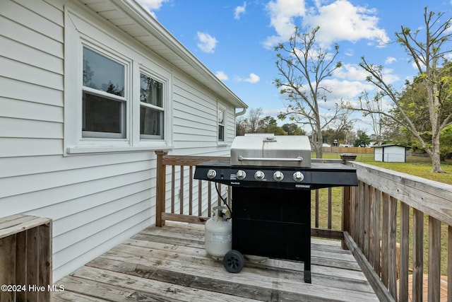 wooden deck featuring grilling area