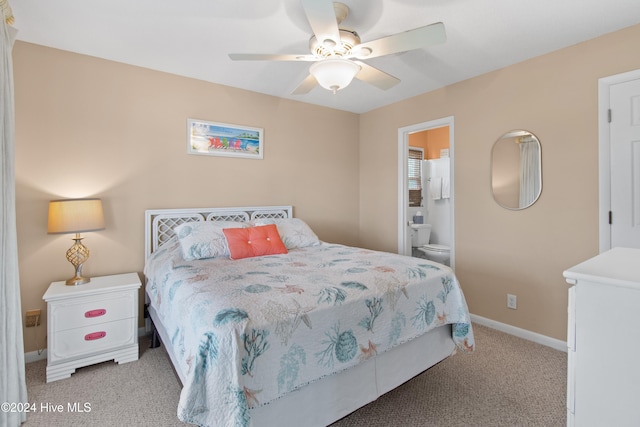 carpeted bedroom featuring connected bathroom and ceiling fan