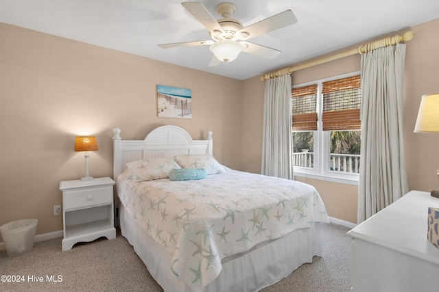 bedroom with ceiling fan and light carpet