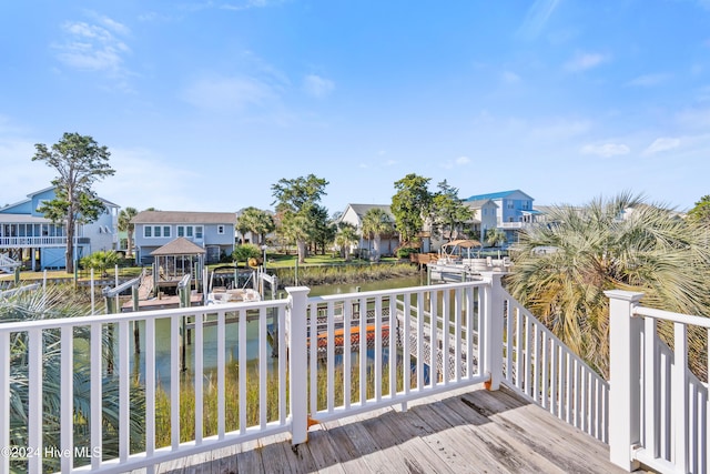 deck featuring a water view and a dock