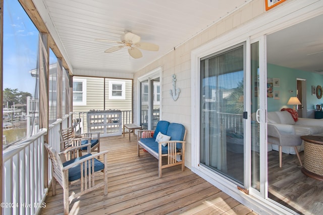 sunroom / solarium with ceiling fan