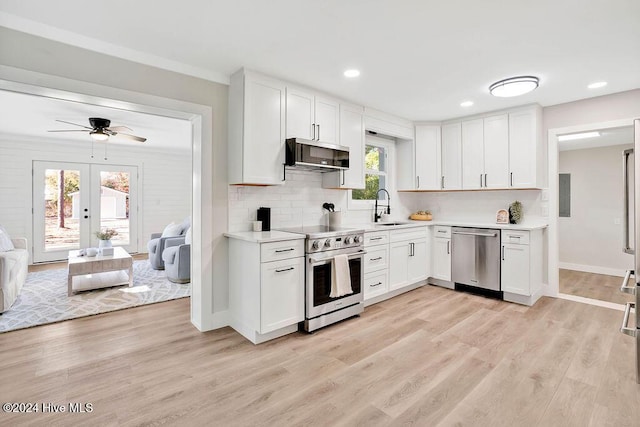 kitchen with white cabinets, stainless steel appliances, and sink