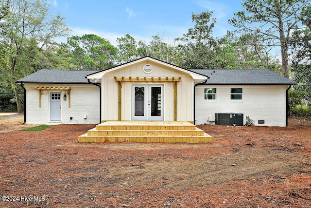 back of property with central AC and french doors