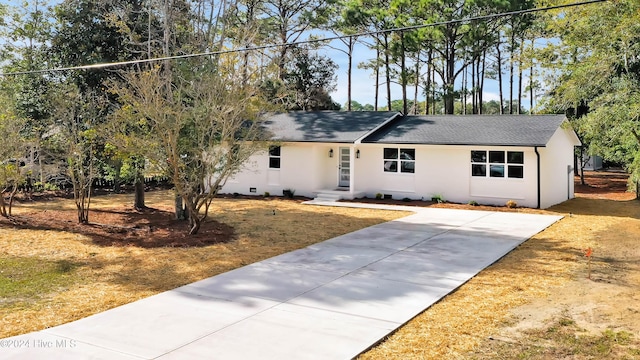 ranch-style house with a front lawn