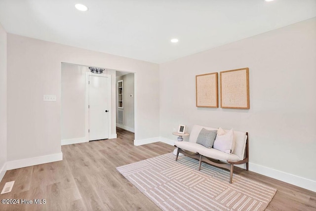 sitting room featuring light hardwood / wood-style floors