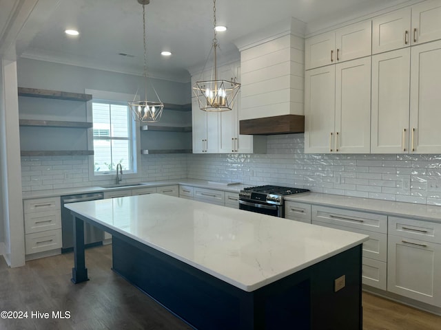 kitchen featuring stainless steel appliances, white cabinetry, backsplash, dark hardwood / wood-style floors, and hanging light fixtures