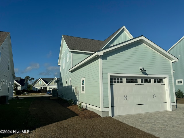 view of home's exterior with central AC