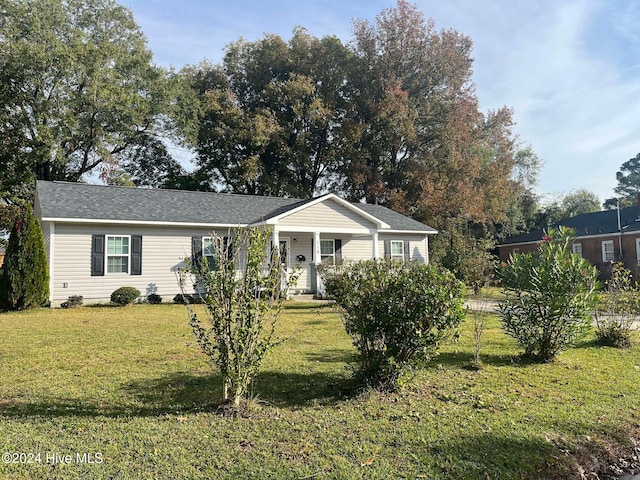 ranch-style house with a front lawn