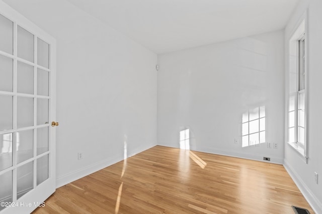 spare room with light hardwood / wood-style floors