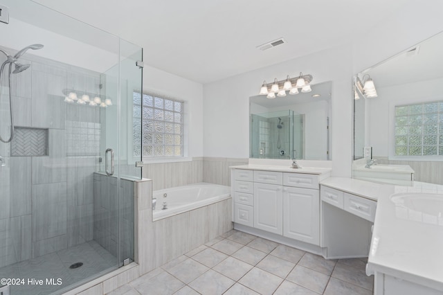 bathroom featuring separate shower and tub, a wealth of natural light, tile patterned flooring, and vanity