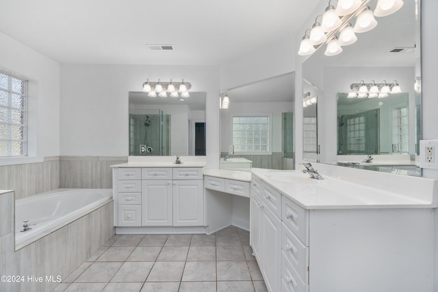 bathroom featuring tile patterned flooring, vanity, and plus walk in shower