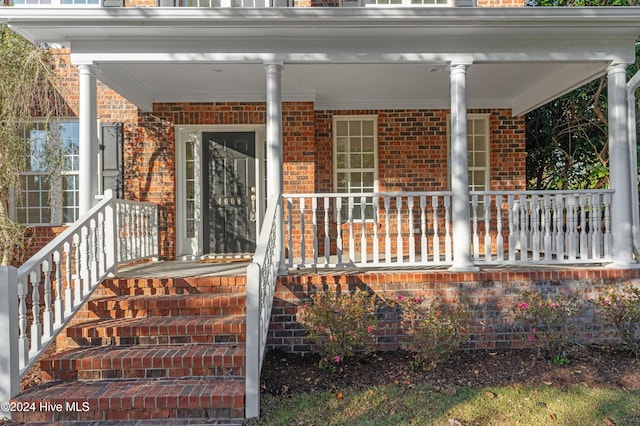 property entrance featuring covered porch