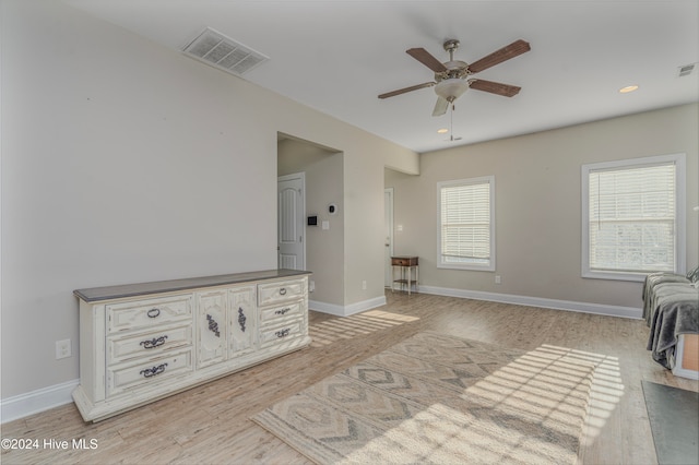 interior space with light hardwood / wood-style floors and ceiling fan