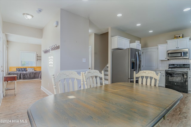 dining room featuring light hardwood / wood-style floors