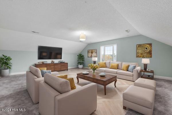 living room featuring vaulted ceiling, light colored carpet, and a textured ceiling