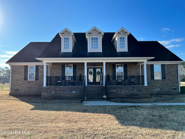 view of front of house featuring a front yard and a porch