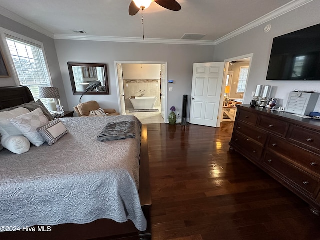 bedroom with crown molding, ceiling fan, dark hardwood / wood-style floors, and connected bathroom