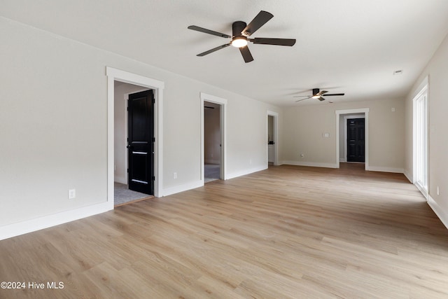 unfurnished living room with ceiling fan and light hardwood / wood-style floors