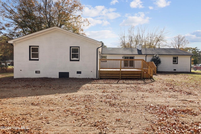 back of house with a wooden deck