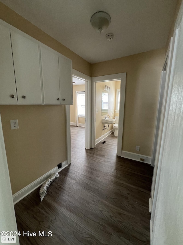 hall with dark hardwood / wood-style flooring