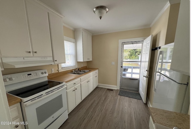 kitchen with plenty of natural light, white cabinets, and white range with electric cooktop