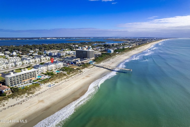 aerial view featuring a water view and a beach view