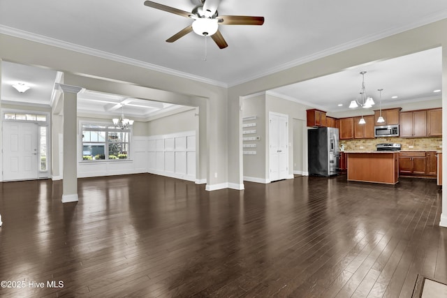 living room featuring a wealth of natural light, ceiling fan, and ornamental molding