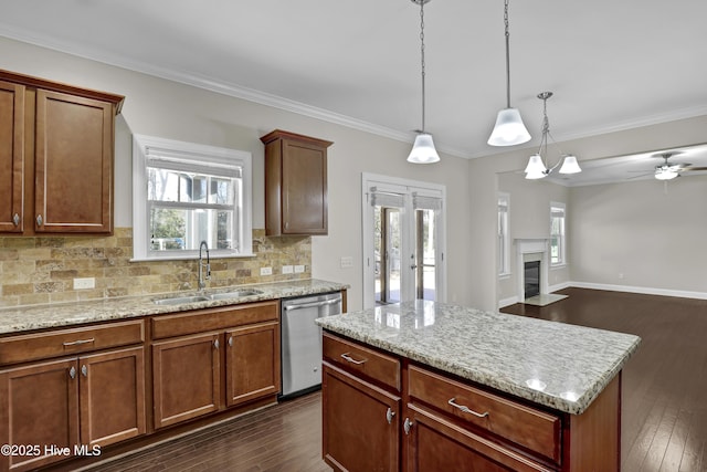 dining area featuring dark wood-type flooring, sink, and crown molding