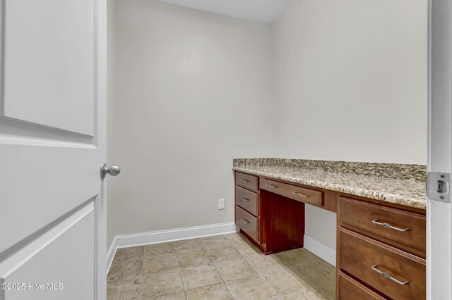 kitchen with a center island, stainless steel dishwasher, dark hardwood / wood-style floors, light stone countertops, and decorative light fixtures