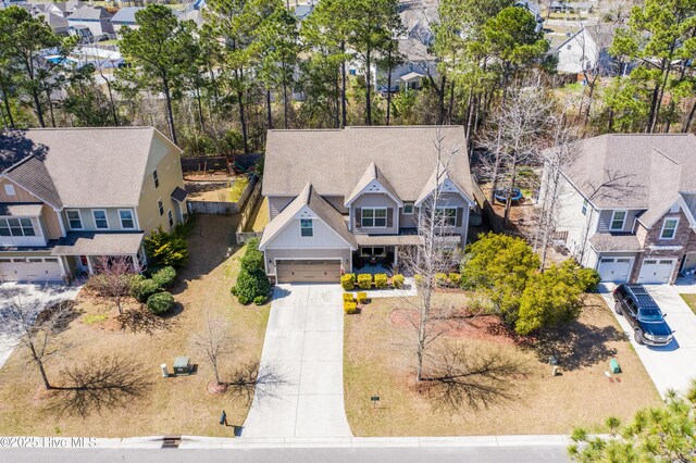 craftsman house with a garage and a front yard