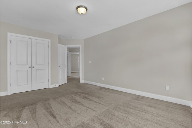 spacious closet with carpet