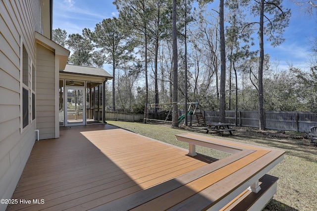 view of yard featuring a sunroom and a playground