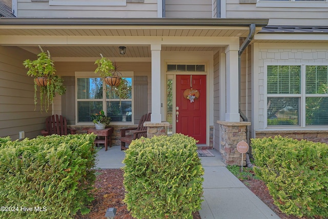 entrance to property with a porch