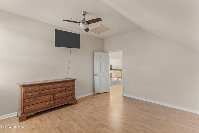 bedroom featuring light hardwood / wood-style flooring, ceiling fan, and vaulted ceiling