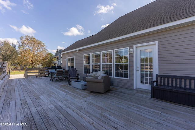 wooden deck featuring outdoor lounge area