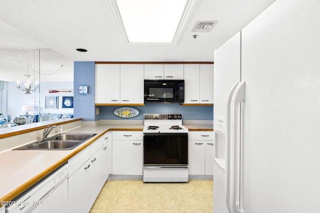 kitchen featuring light floors, visible vents, white cabinetry, a sink, and white appliances