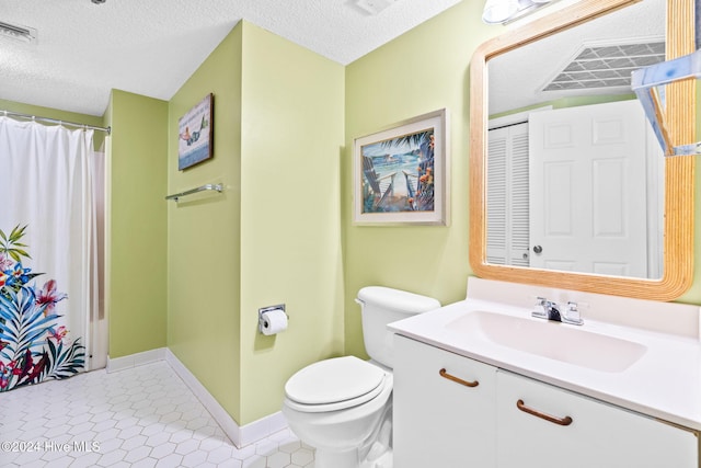 full bathroom featuring baseboards, visible vents, toilet, a textured ceiling, and vanity