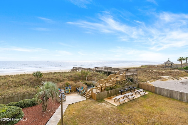 exterior space with a beach view and a water view