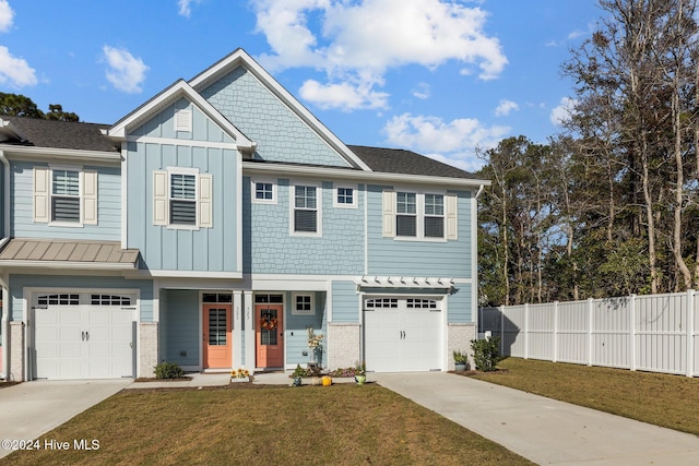 view of front of house with a garage and a front yard